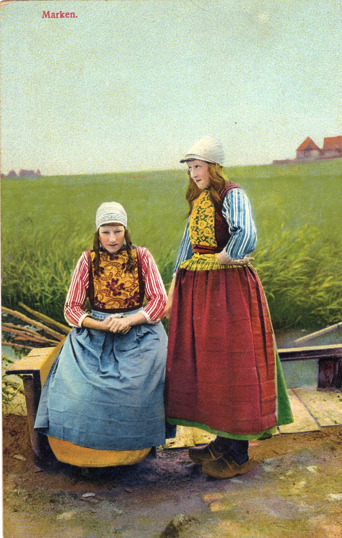 Postcard with two Marken girls wearing decorative chest panels, early 20th century (TRC 2018.0454).