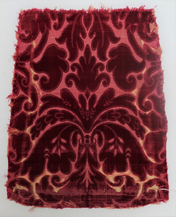 Chair cover in red cicel&eacute; velvet in silk (17th century, Europe; TRC 2011.0368).