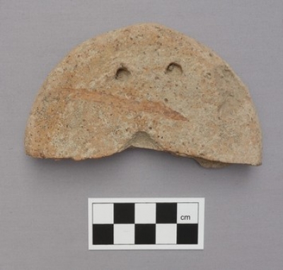 Roman-period loom weight from Greece, made of clay.