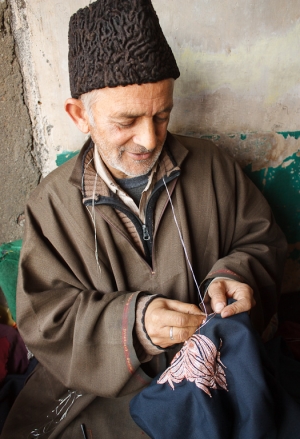 Embroiderer of zari (Indian goldwork) embroidery.