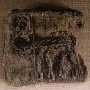 This piece of embroidery depicts a stag turning its head. It is carried out in the couching technique. A grave find from Bj&ouml;rk&ouml; (Birka), Adels&ouml;, Uppland, Sweden.