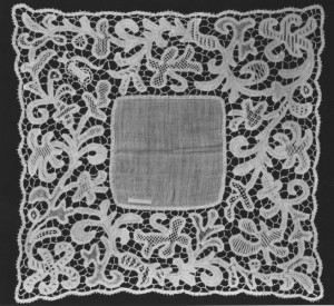 Handkerchief with machine woven tape lace. UK, late 19th century.