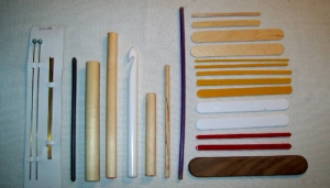 Assortment of netting gauges or mesh sticks (left).