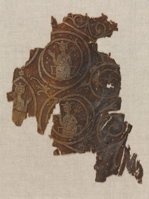 Fragment of pontifical stocking, worked in Opus Anglicanum, from Worcester Cathedral, dated first half of the 13th century.