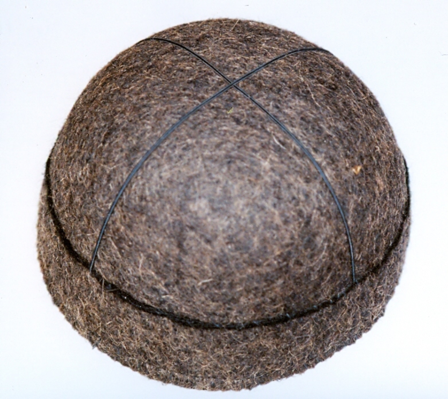 A brown felt cap from the Svan in northwestern Georgia, the Caucasus, late 20th century (TRC 1998.0027).