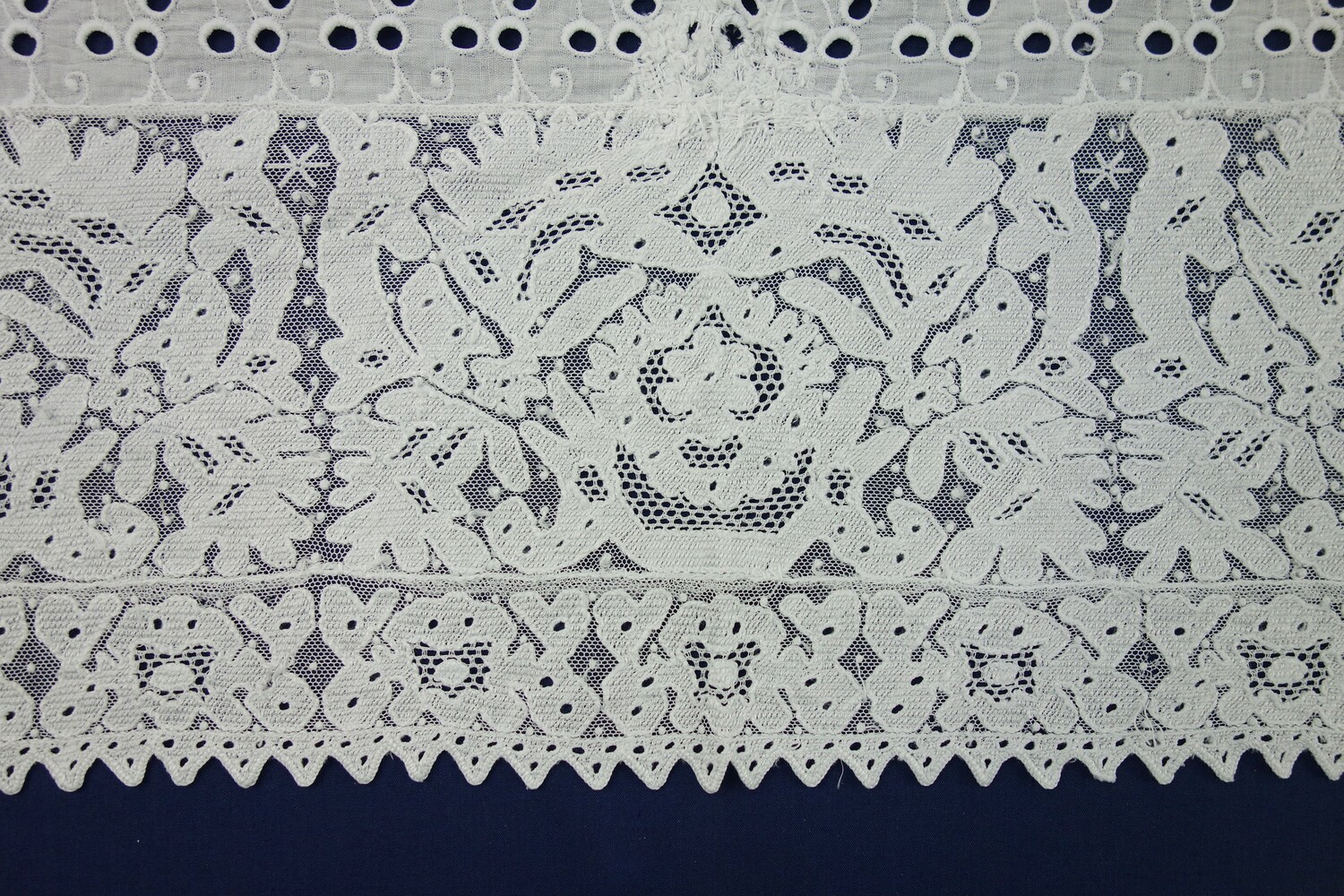 Part of a machine embroidered (broderie anglaise) lace cap from Zeeland, the Netherlands, 1920s (TRC 2006.0070).