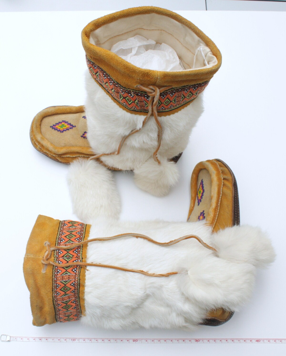 Pair of embroidered and beaded boots produced and worn by Canadian Inuit, late 20th century (TRC 2009.0260a-b).