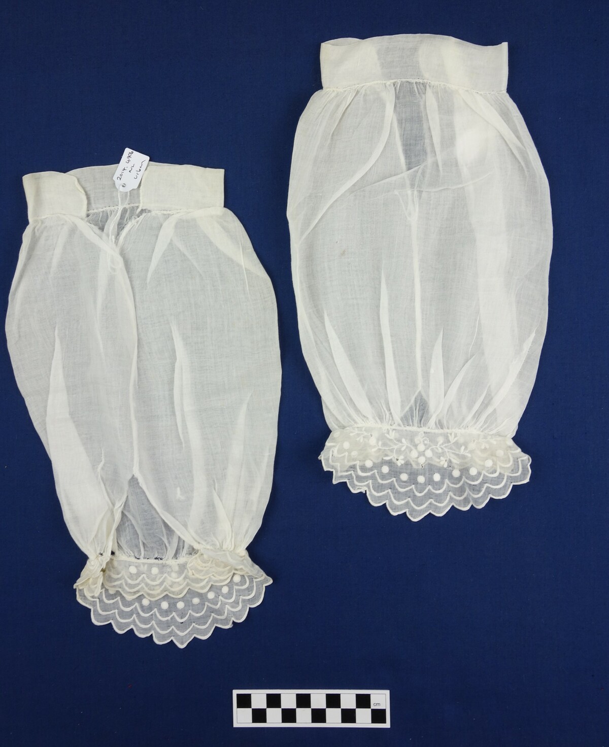 Pair of engageantes, mid-19th century (TRC 2014.0470a b).