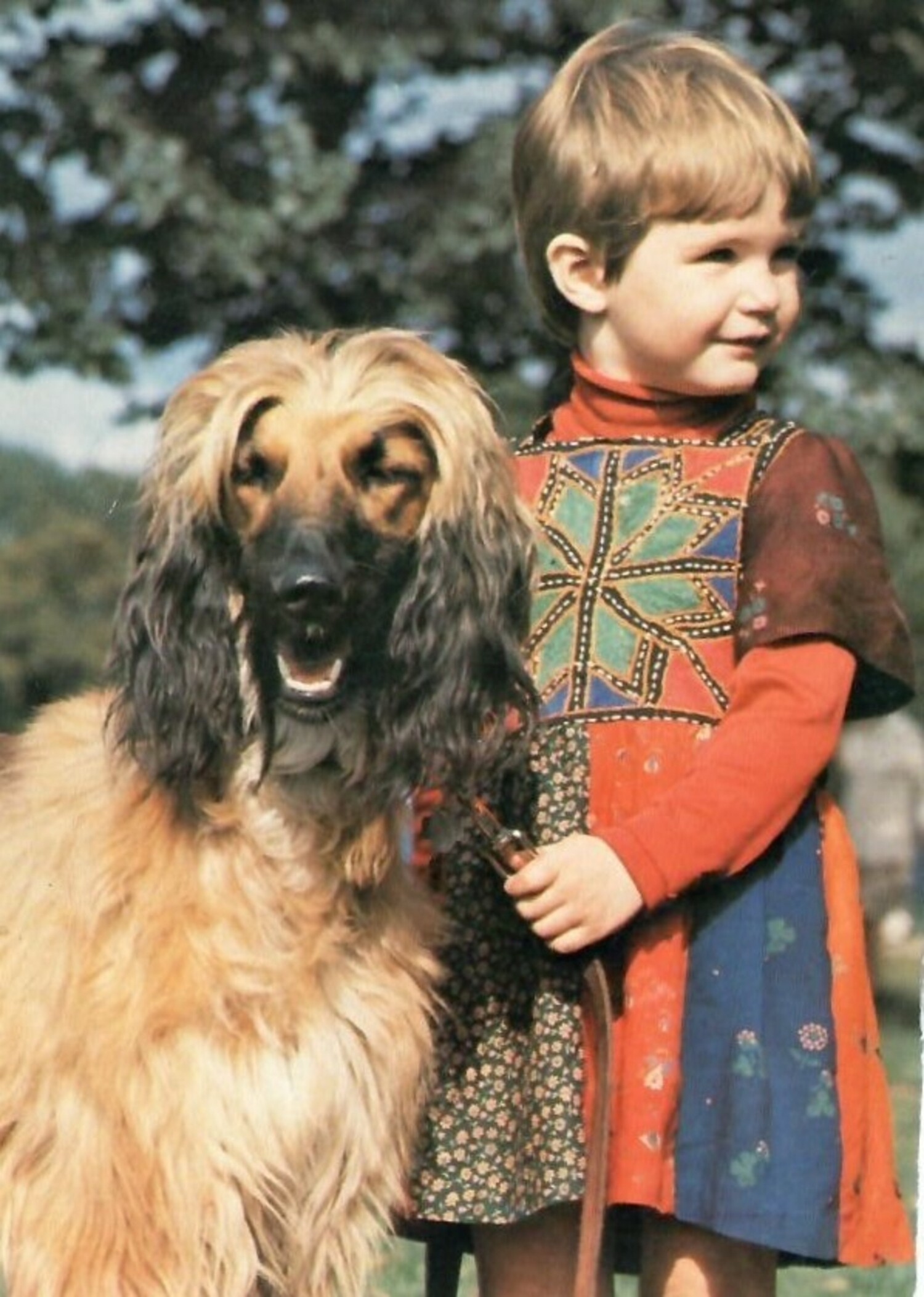 Postcard of a young Dutch girl wearing an Afghan (Hazara) style dress (TRC 2020.0008). The card was posted in 1993.
