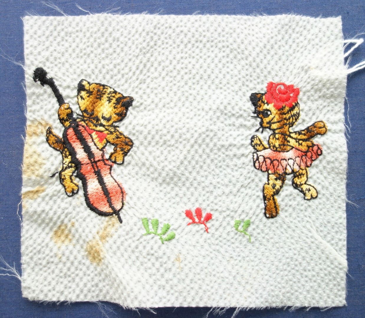 A piece of embroidered seersucker cloth with two cats. Europe, 20th century (TRC 2020.1709).