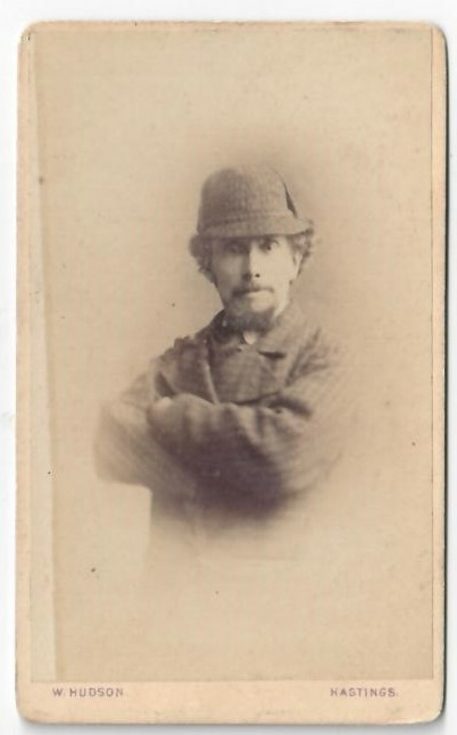 Man with a hat of the deer-stalker type, made popular by Sherlock Holmes. Britain, late 19th century (TRC 2020.3034).
