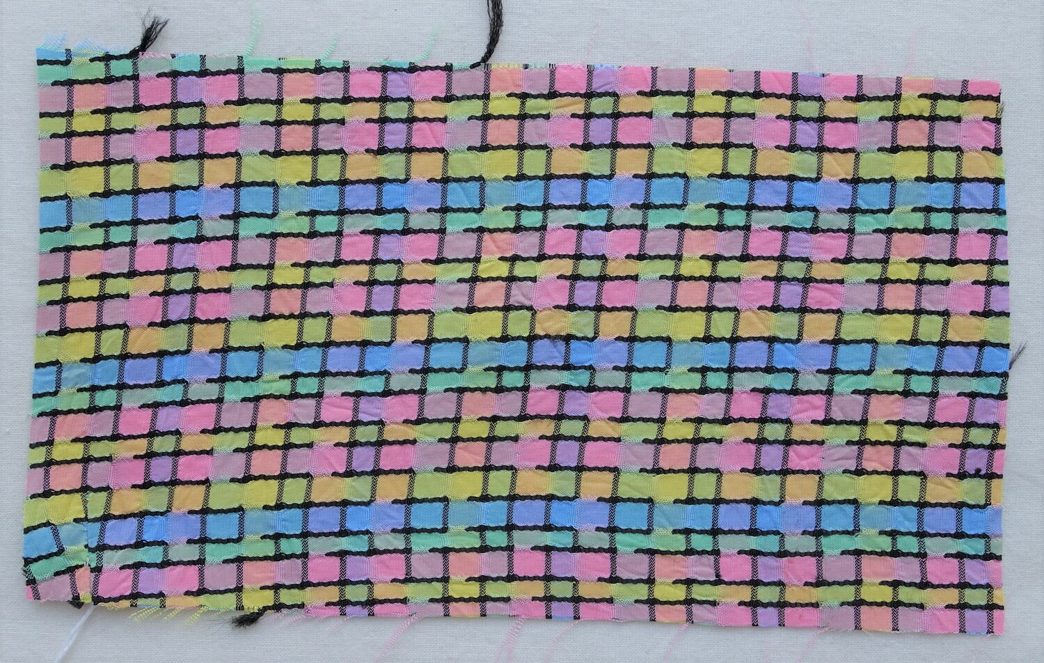 Woven panel with decoration in the Mondriaan style of analytical cubism, 1920s-1930s (TRC 2021.0291).
