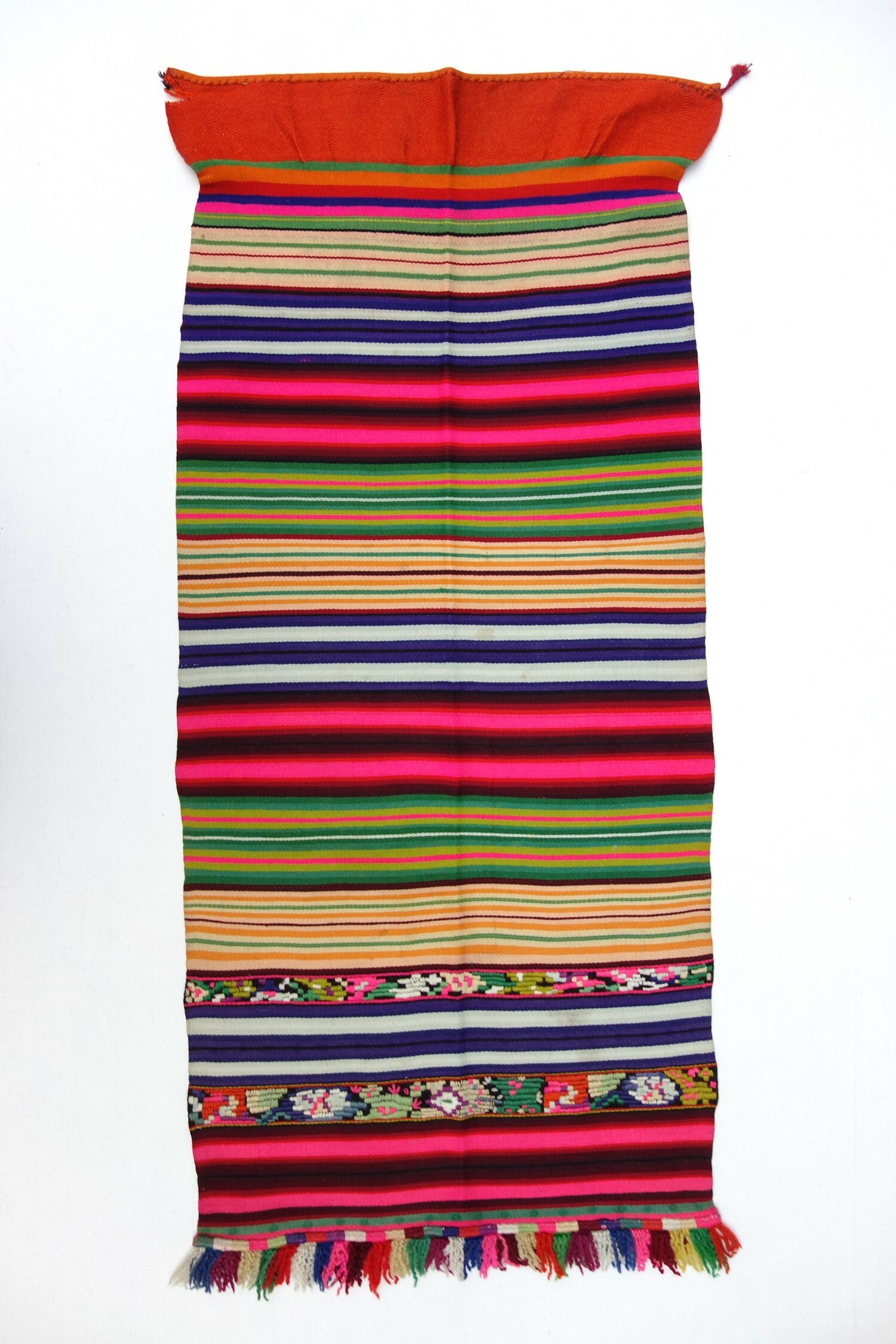 Fig. 9. A woman's apron from Romania, from hand spun and woven cloth, and hand embroidered (cross stitch), and macrame, 20th century (TRC 2022.0485).