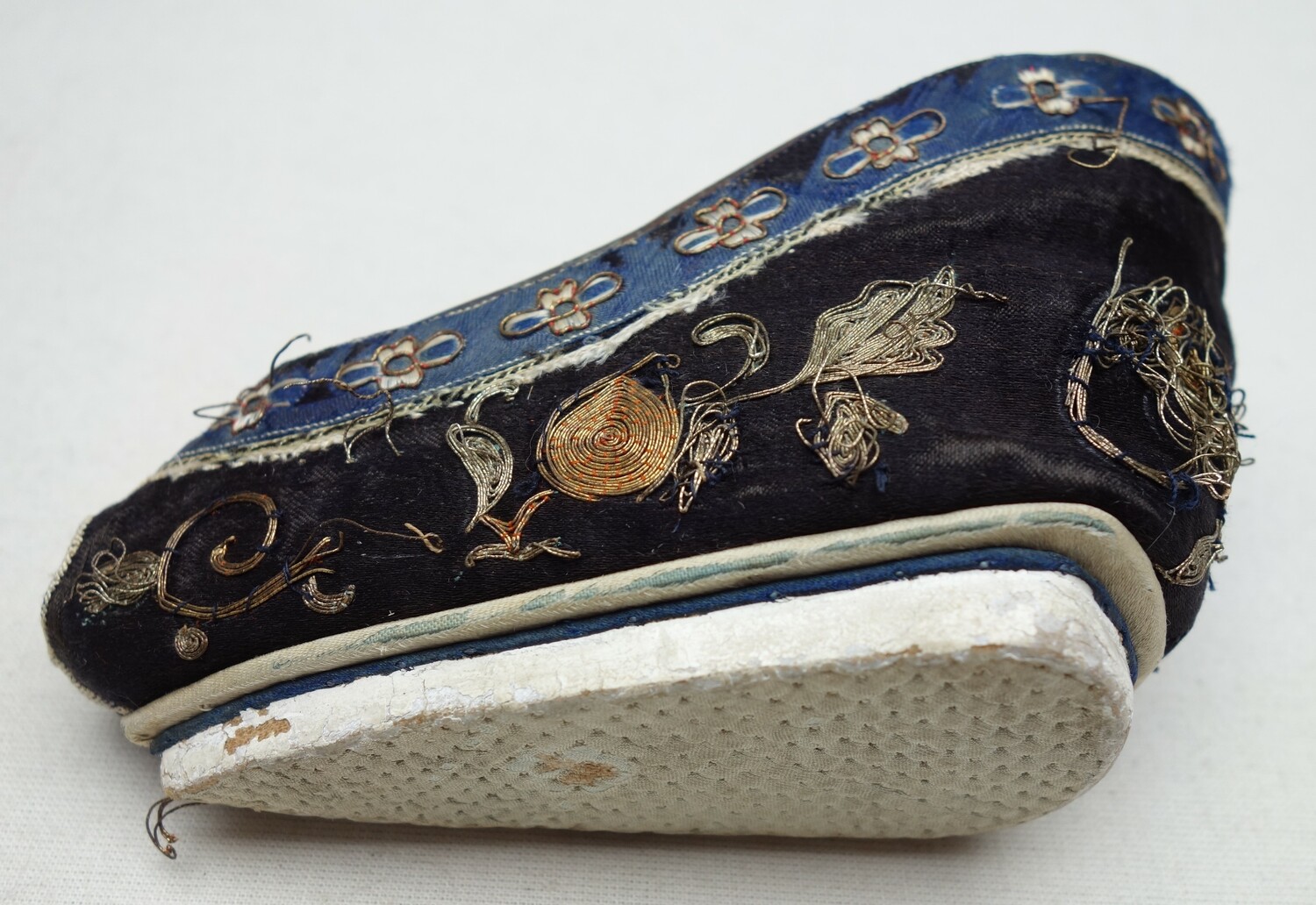 'Ashtray' lotus shoe, early 20th century (TRC 2023.1267a).