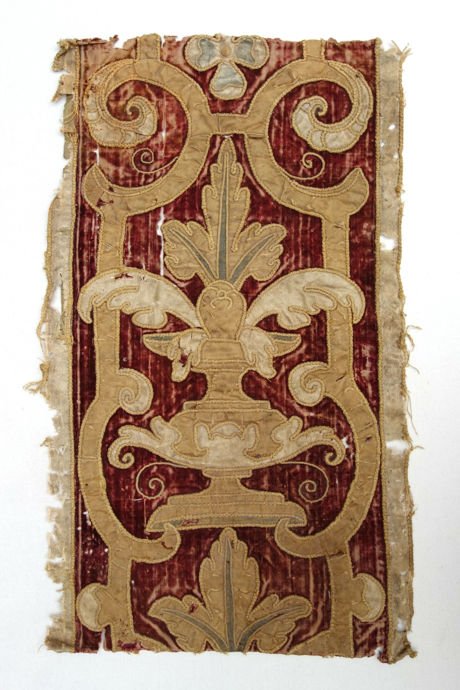 Fig. 3. Sample of a piece of strapwork made from dark red silk velvet. Europe, late 16th century (TRC 2024.3205).