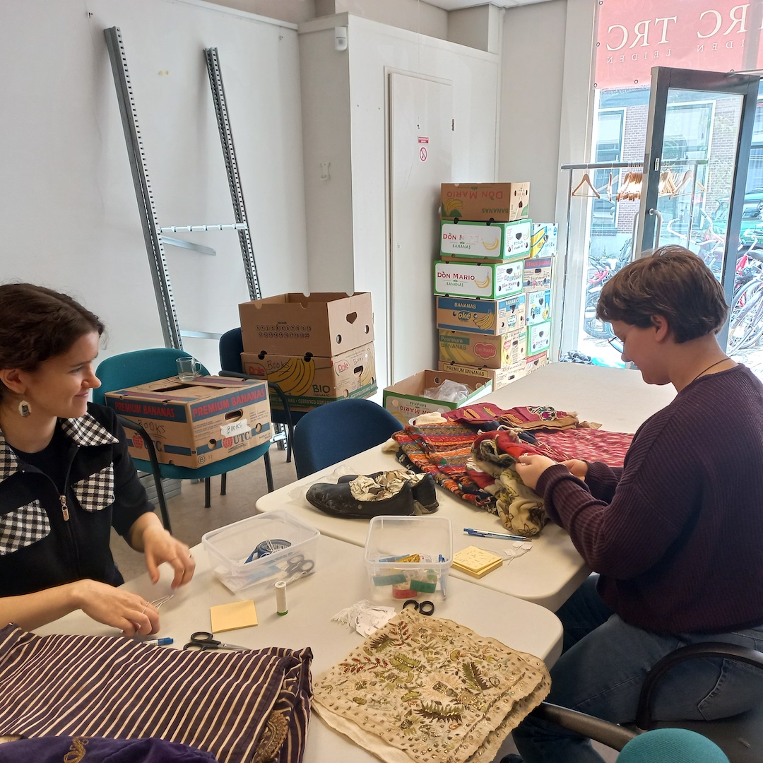 Fig. 1. TRC interns ctaloguing Turkish garments recently donated to the TRC (photograph by author).