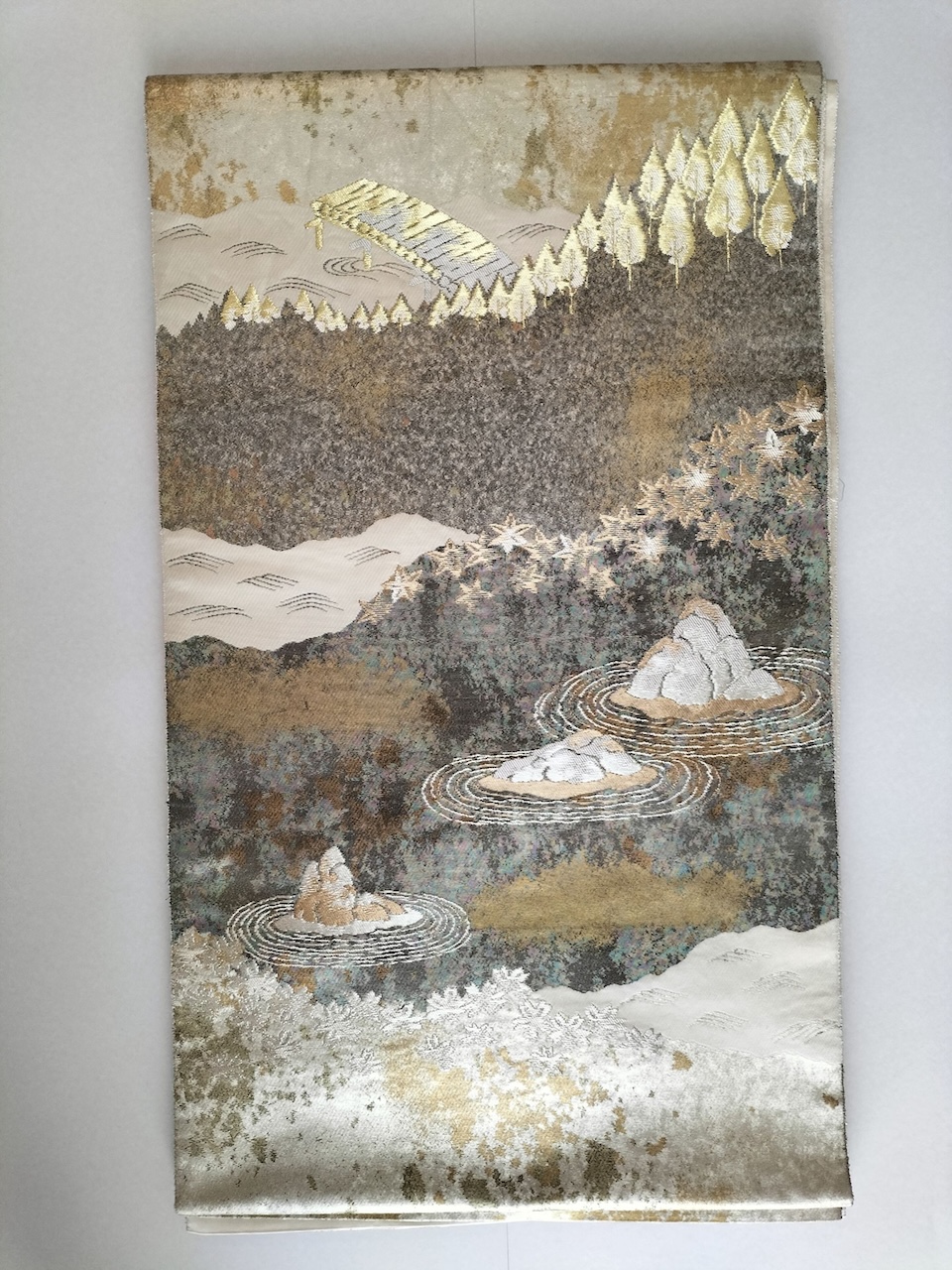 Fig. 6. Part of an obi with Japanese garden pattern, created by hikibaku.