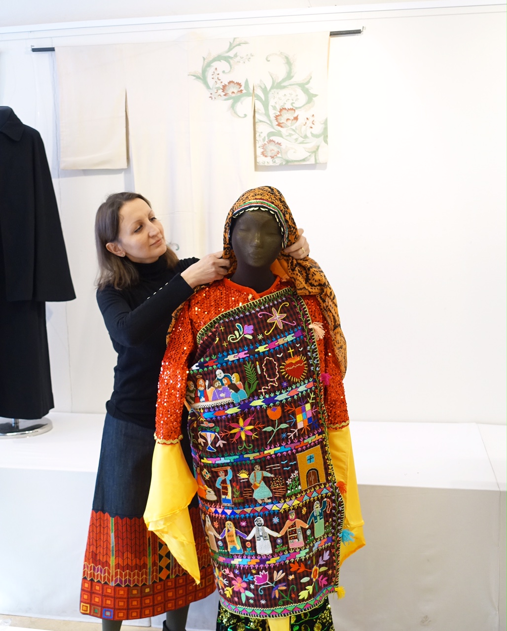 The author dressing a mannequin with the charuga outfit. Photograph by Augusta de Gunzbourg.