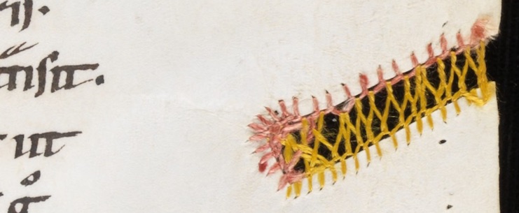 A parchment gap strengthened and decorated with open buttonhole stitch with Cretan stitch, which are worked in pink and yellow silk threads (Engelberg, Stiftsbibliothek / Cod. 22 – Gregorius M., Moralia in Job, t. III / f. 54r).