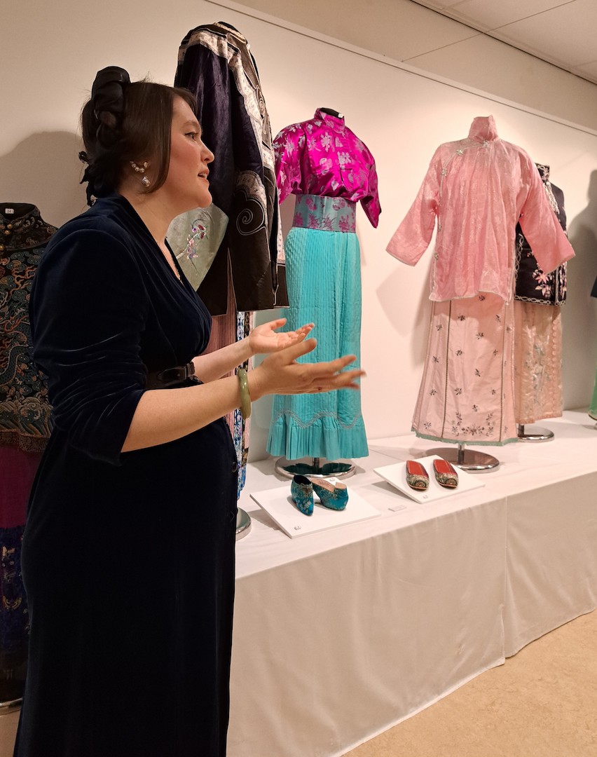 Augusta de Gunzbourg, curator of the exhibition, explains the concept of the display. Photograph by TRC volunteers.