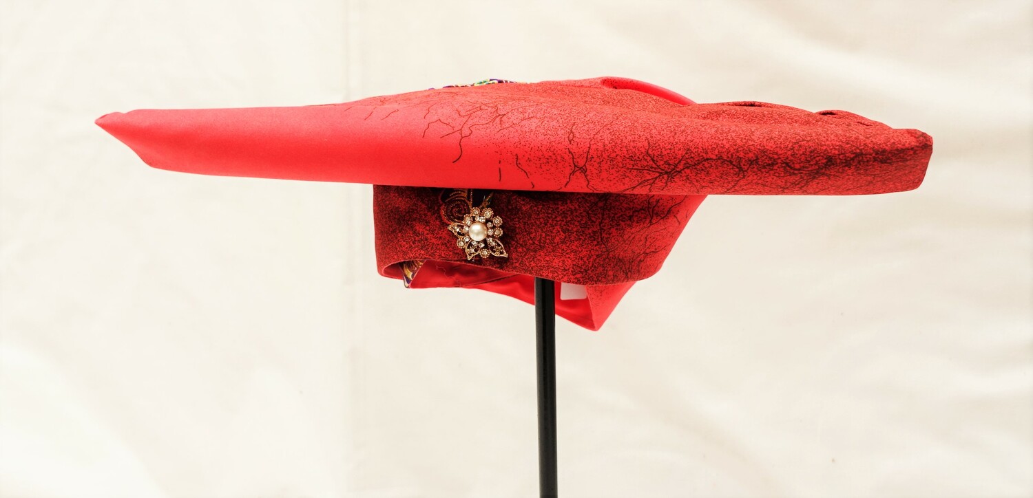 Hat from Namibia that goes with the outfit with dress and belt (TRC 2022.3119c).