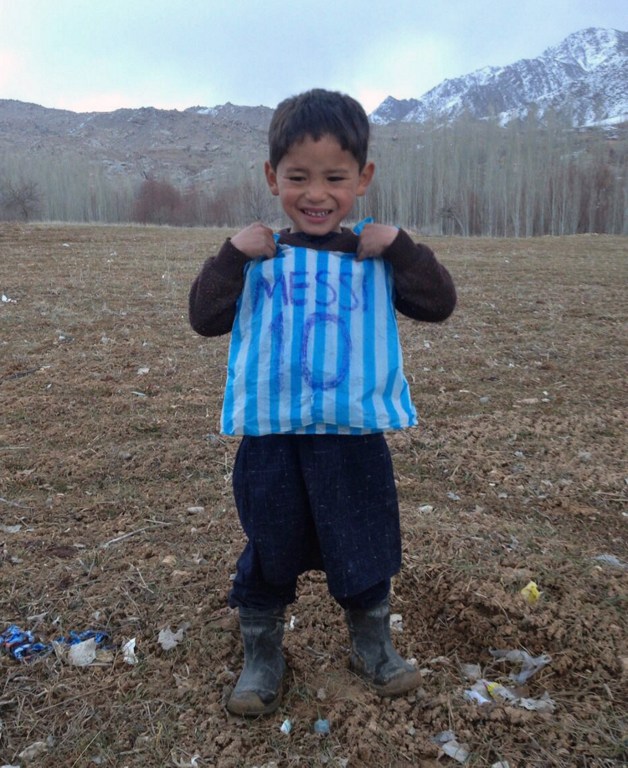 Murtaza Ahmadi with his Messi T-shirt. Photograph by his brother.